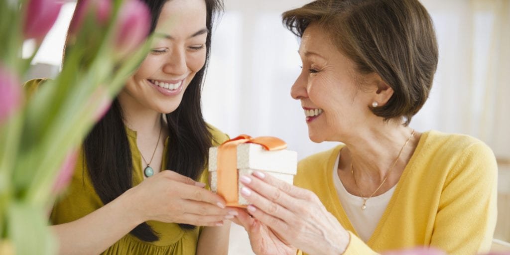 Japanese daughter giving mother gift